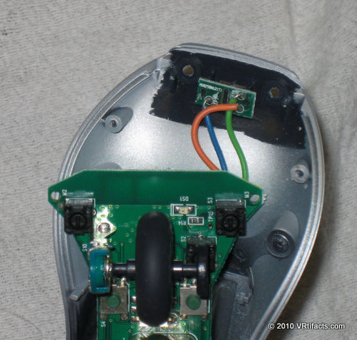 Pull the circuit boards free. The tiny board at the tip of the mouse is lightly glued on. Pull it off the plastic bottom of the mouse.