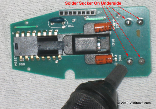 Solder sucker on underside of battery clips.