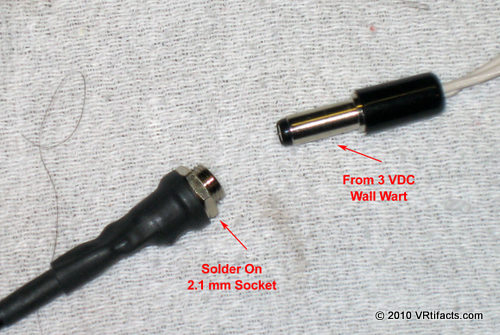 Solder on a 2.1 mm power socket on the other end of the 2 conductor cable. Be careful to put positive on the tip and negative on the sleeve.